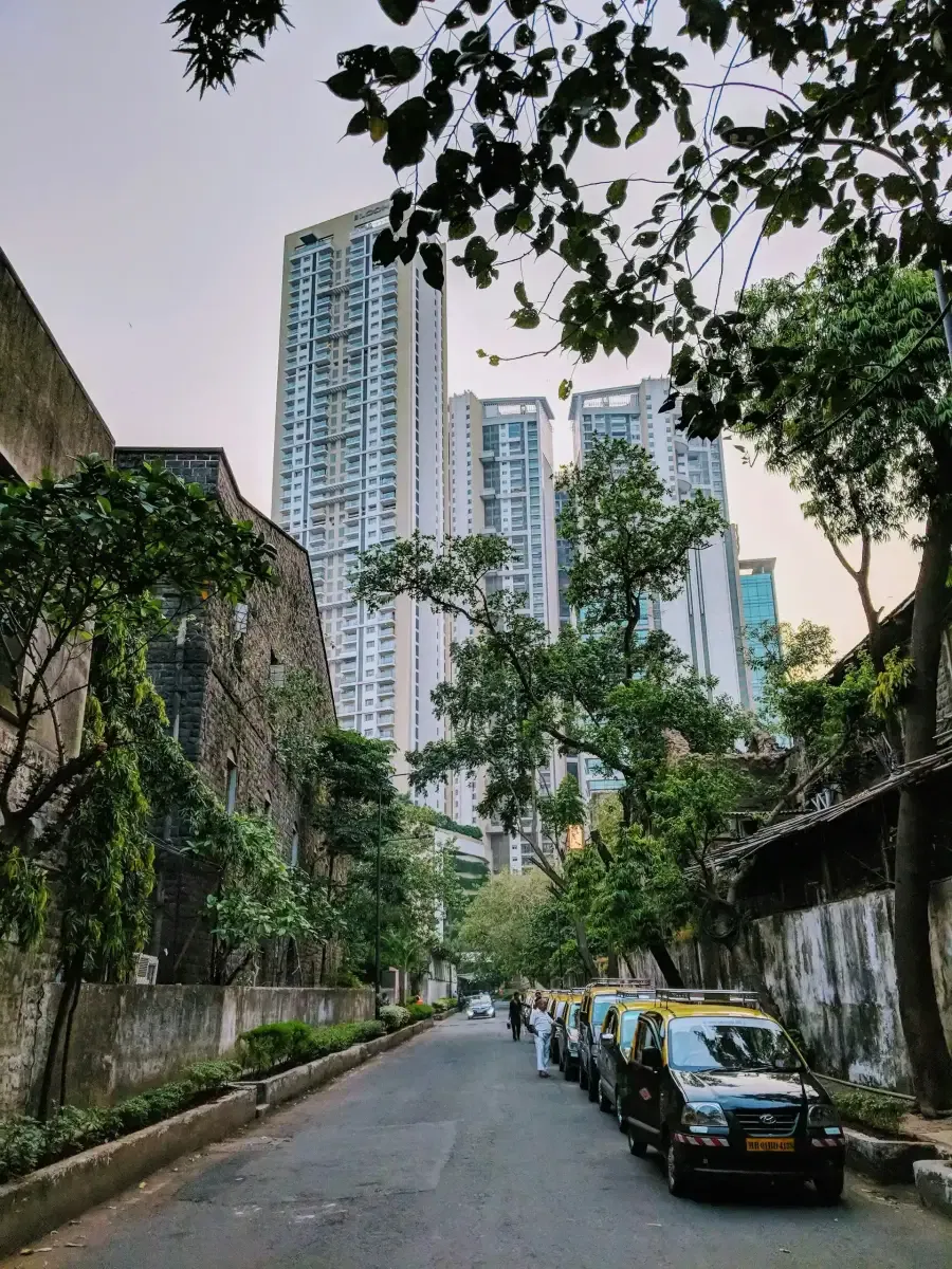 Modern residential towers framed by greenery